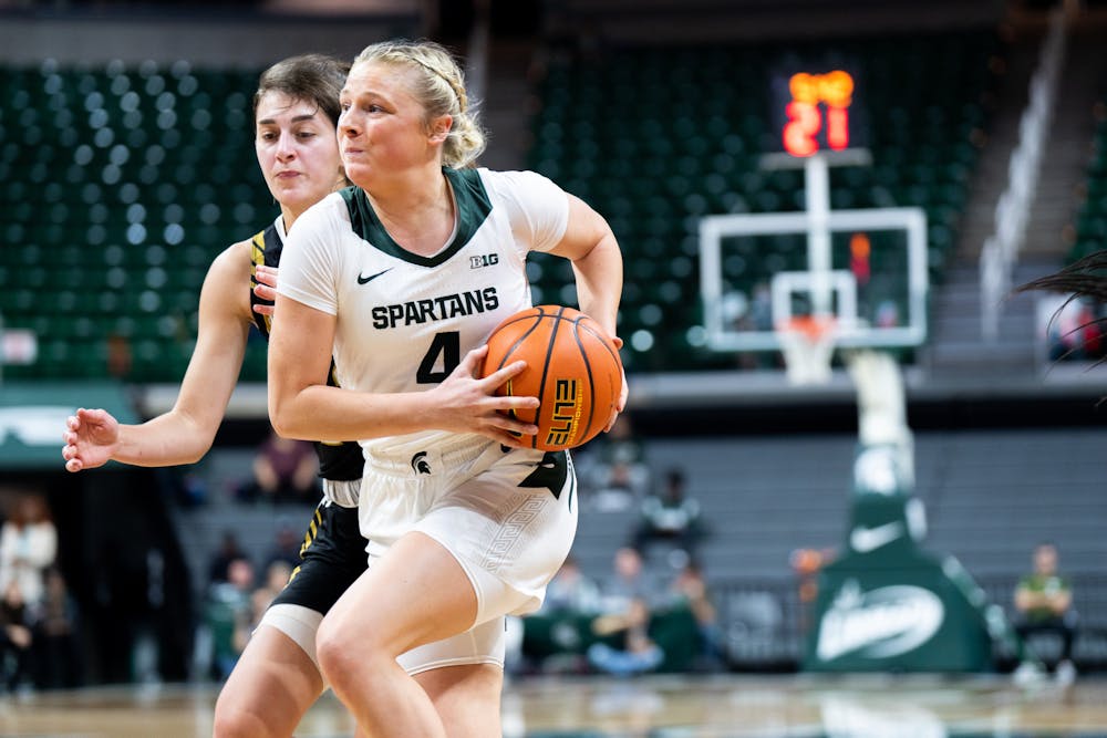 <p>Freshman guard Theryn Hallock (4) shoots the ball during a game against Purdue Fort Wayne at Breslin Center on Nov. 10, 2022. The Spartans defeated the Mastodons with a score of 85-53.</p>