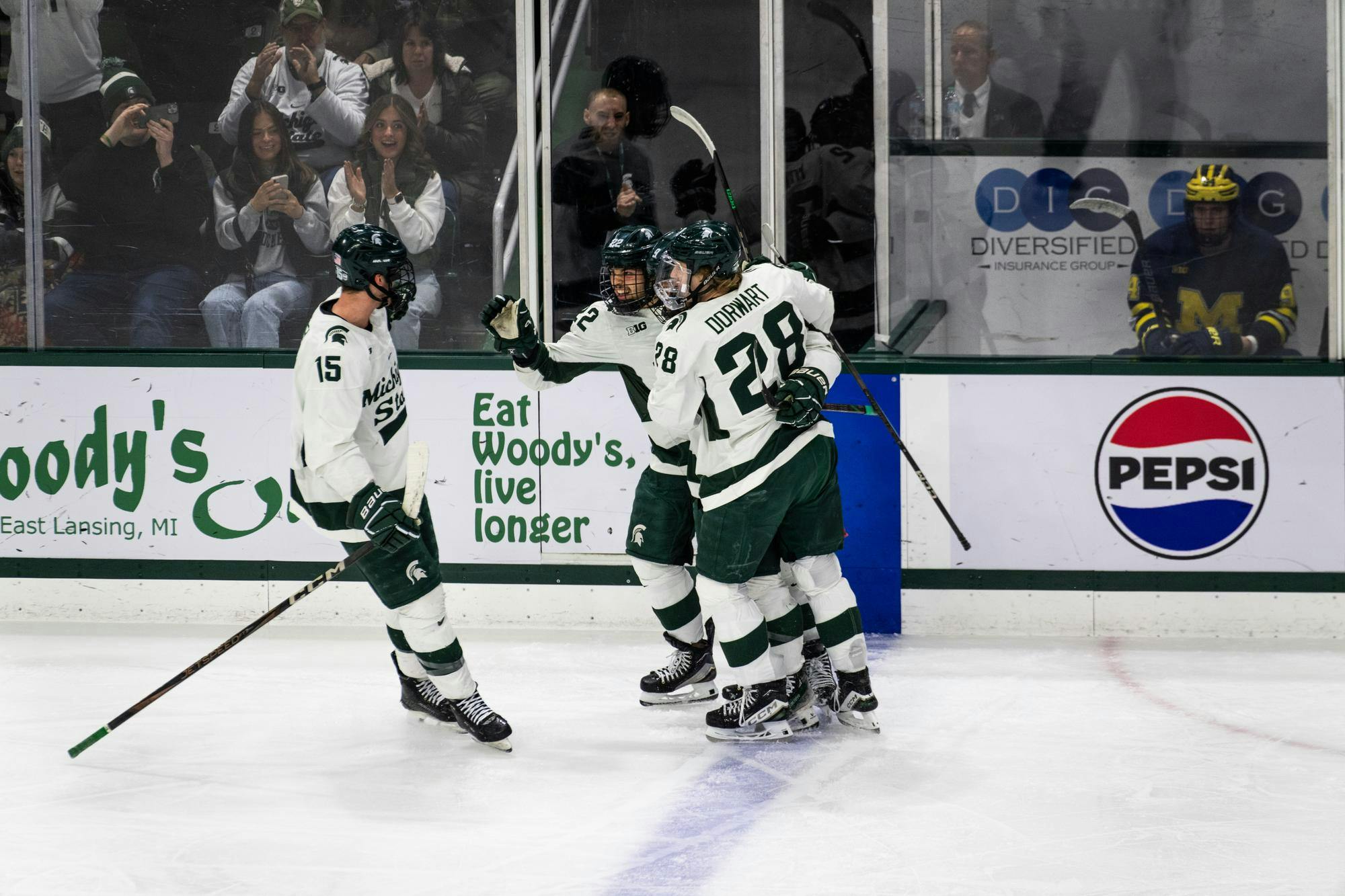 Michigan State players celebrate a powerplay goal at Munn Ice Arena in East Lansing, Michigan on Jan. 18, 2025. The in-state rivals split their first series of the season, with Michigan State securing a convincing 4-1 victory to close the series.