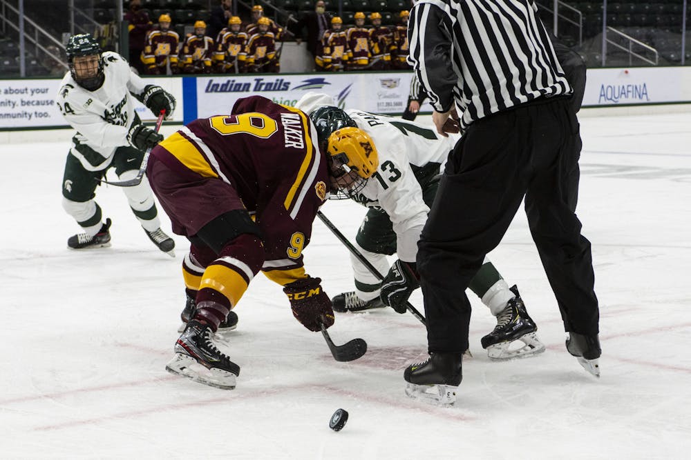 <p>Freshman forward Kristof Papp (13) faces off against Minnesota&#x27;s Sammy Walker (9) in the first period. The Spartans fell to the Golden Gophers, 3-1, on Dec. 3, 2020.</p>