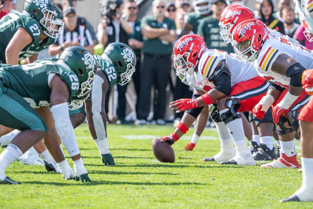 <p>A Maryland player about to snap the ball during a game against Michigan State at Spartan Stadium on Sept. 23, 2023. The Spartans are losing to the Terrapins 21-3 at halftime.</p>