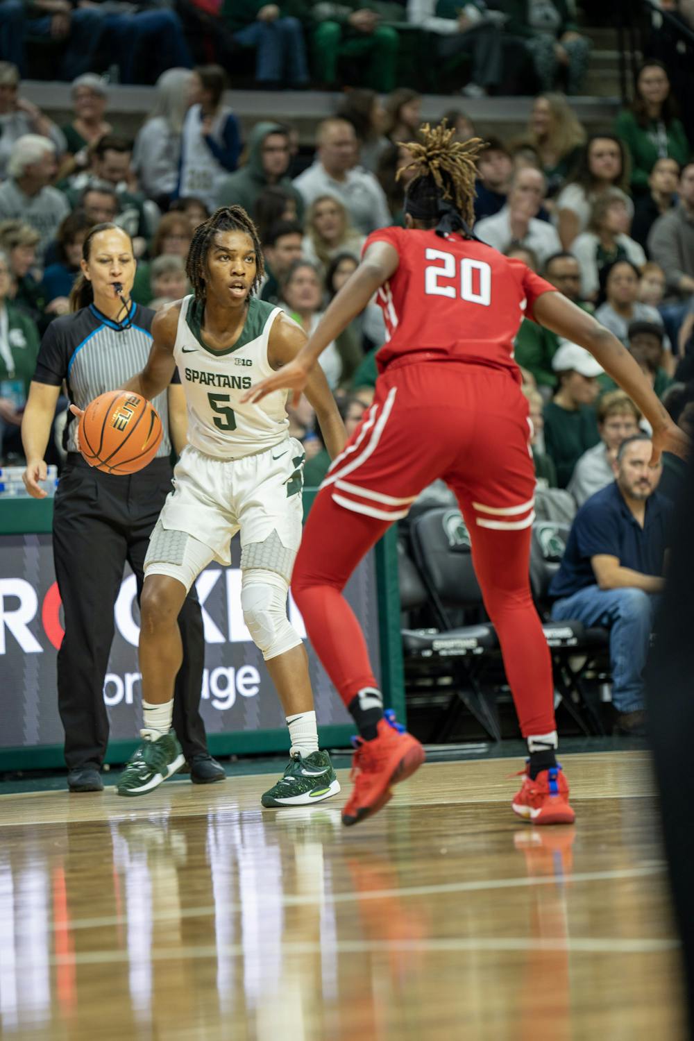 <p>Graduate student guard Kamaria McDaniel, as she handles the ball during the MSU v. Rutgers game held at the Breslin Center on Jan. 22, 2023. The Spartans won against Rutgers 85-63.</p>