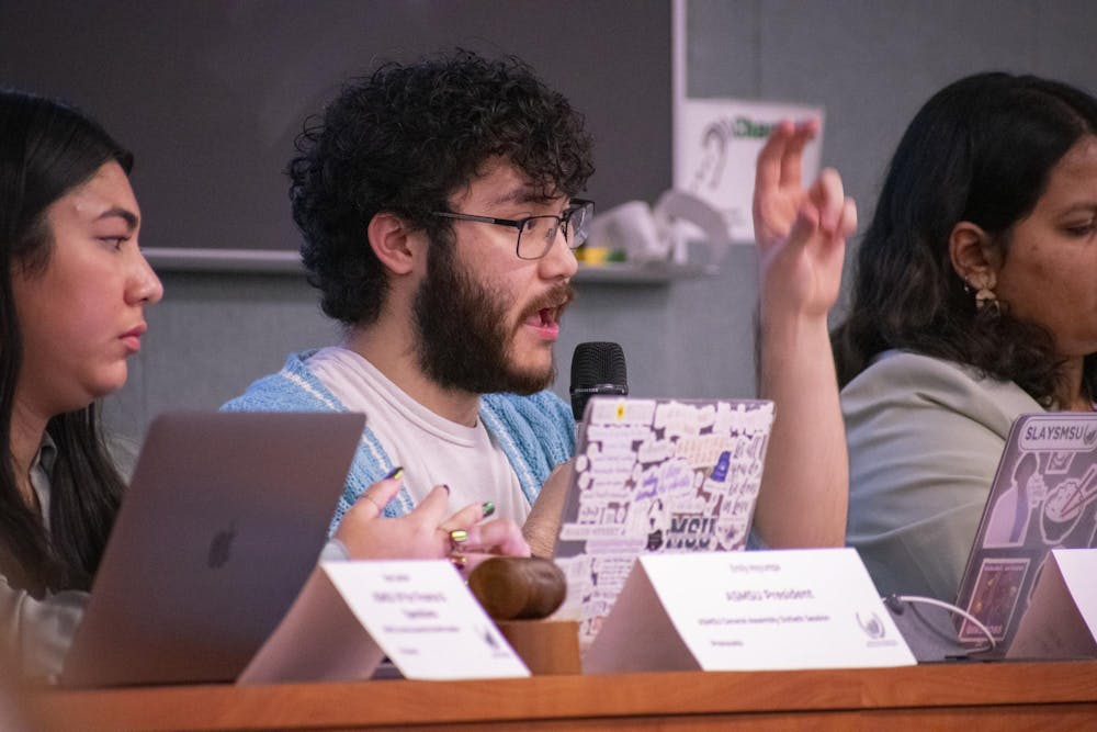 Connor Le, the ASMSU vice president for internal administration, clarifies bill 60-46 during the ASMSU General Assembly meeting on Dec. 7, 2023 at the International Center.