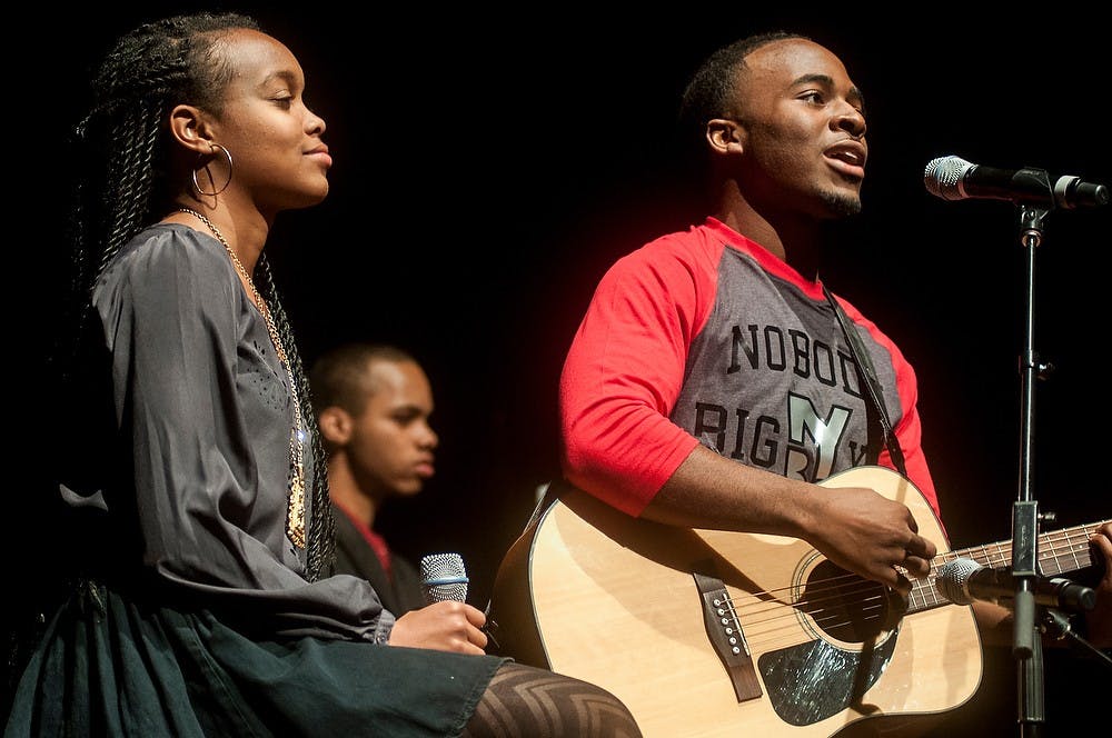 	<p>Communication sophomore Leticia Gittens, left, and marketing sophomore Chris Jackson II, right, performs a song on stage during the 41st Annual Black Power Rally on Nov. 13, 2013, at Wharton Center. The event highlighted many of the struggles African Americans go through and also celebrated their culture. Khoa Nguyen/The State News</p>