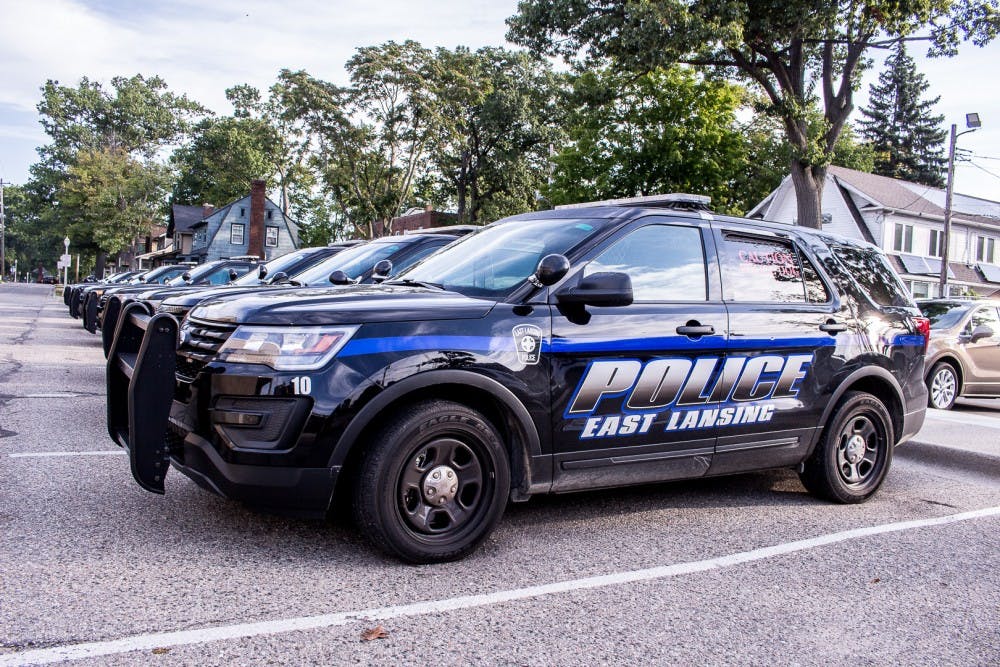 Police cars parked outside of 54-B District Court in East Lansing.