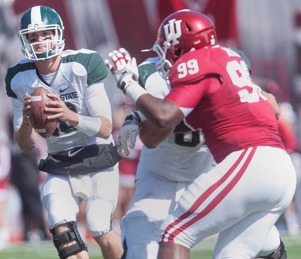 	<p>Junior quarterback Andrew Maxwell looks down the field Saturday, Oct. 6 at Memorial Stadium in Bloomington, Ind. Despite trailing to Indiana at half-time, the Spartans were able to earn the 31-27 victory. Adam Toolin/The State News</p>