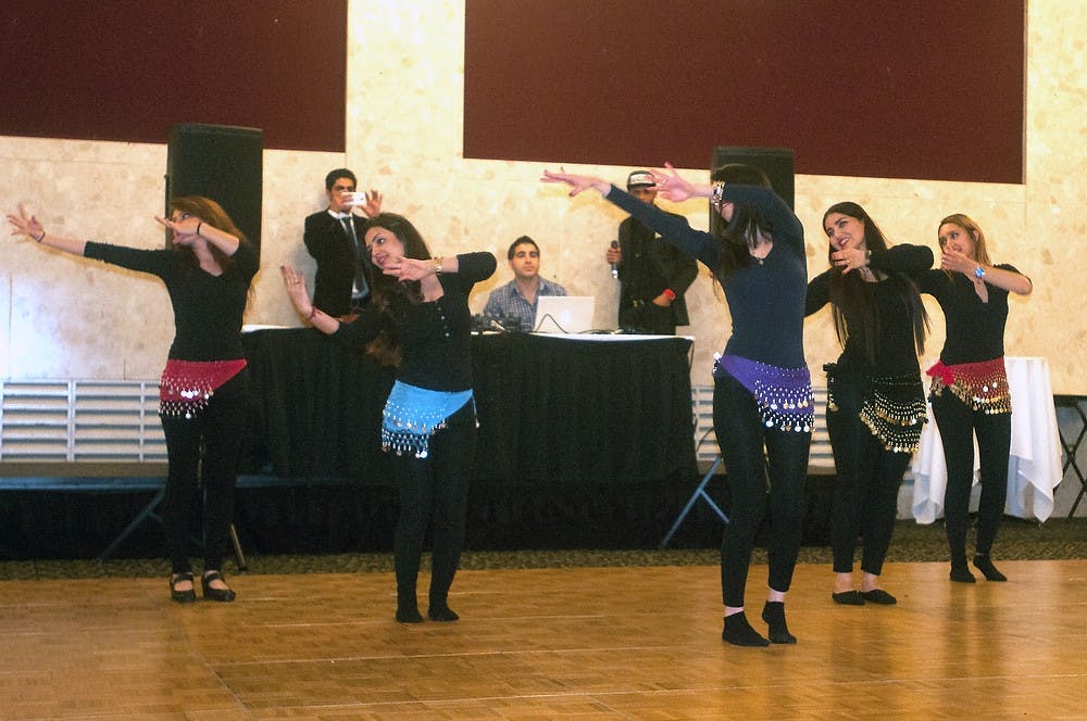 <p>Members of the Persian Student Association perform a traditional dance March 20, 2015, at the MSU Union during their celebration of the Persian New year. Kennedy Thatch/The State News</p>