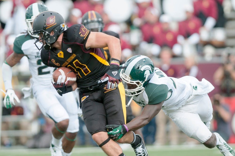 Redshirt freshman safety RJ Williamson tackles wide receiver Cody Wilson. The Spartans defeated the Chippewas, 41-7, on Saturday, Sept. 8, 2012, at Kelly/Shorts Stadium in Mount Pleasant, Mich. Griffin Zotter/The State News