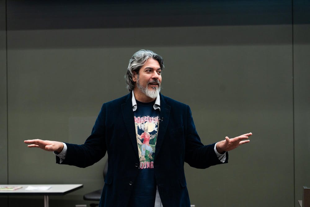 John Foret speaking at the Business College Complex on Thursday, Nov. 16, 2023. Foret spoke about the effects of climate change on the culture of his home state of Louisiana as part of Geography Awareness Week.