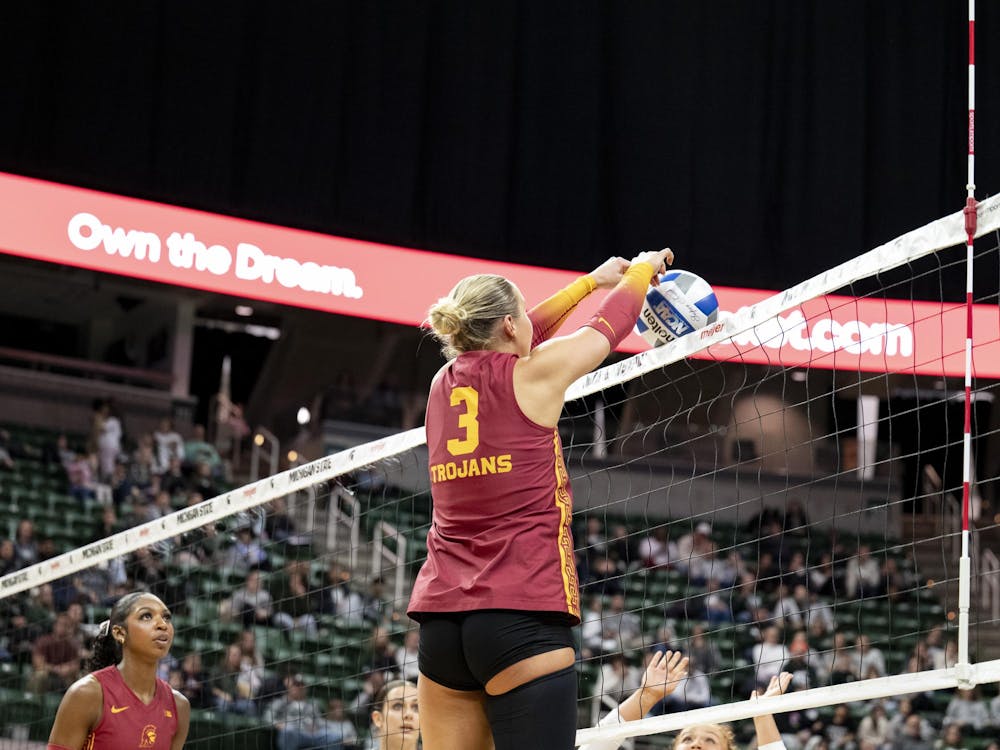 Reese Messer (3), a freshman setter for USC, tips the ball over the net during the match against Michigan State at the Breslin Center on Wednesday, Nov. 26, 2025.
