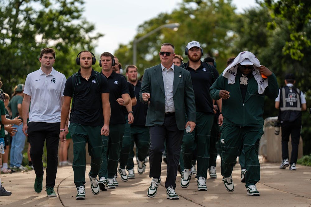 <p>Michigan State head football coach Pat Fitzgerald walks with his team ahead of the Michigan State vs. Toledo football game at Spartan Stadium in East Lansing, Mich., on Friday, Sept. 4, 2026.</p>