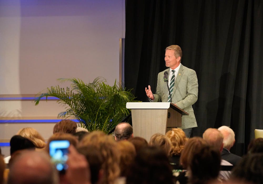 MSU President Kevin Guskiewicz introduces Gov. Gretchen Whitmer during her book tour on campus on July 23, 2024. 