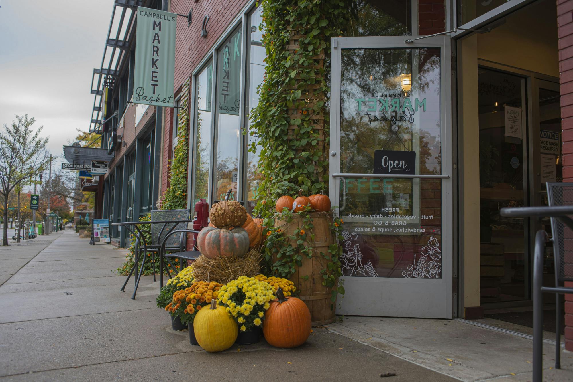 <p>Campbell&#x27;s Market Basket, located on Grand River Avenue, displays pumpkins and fall colored flowers at both entrances. Shot on Oct. 18, 2020.</p>