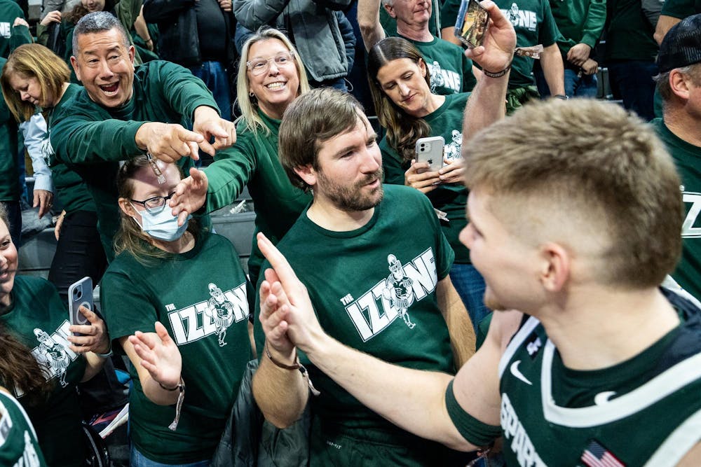 Fans celebrate Michigan State junior forward Jaxon Kohler (0) following a game against the University of Washington at the Breslin Center in East Lansing, Michigan on January 9, 2025. Michigan State won 88-54. 