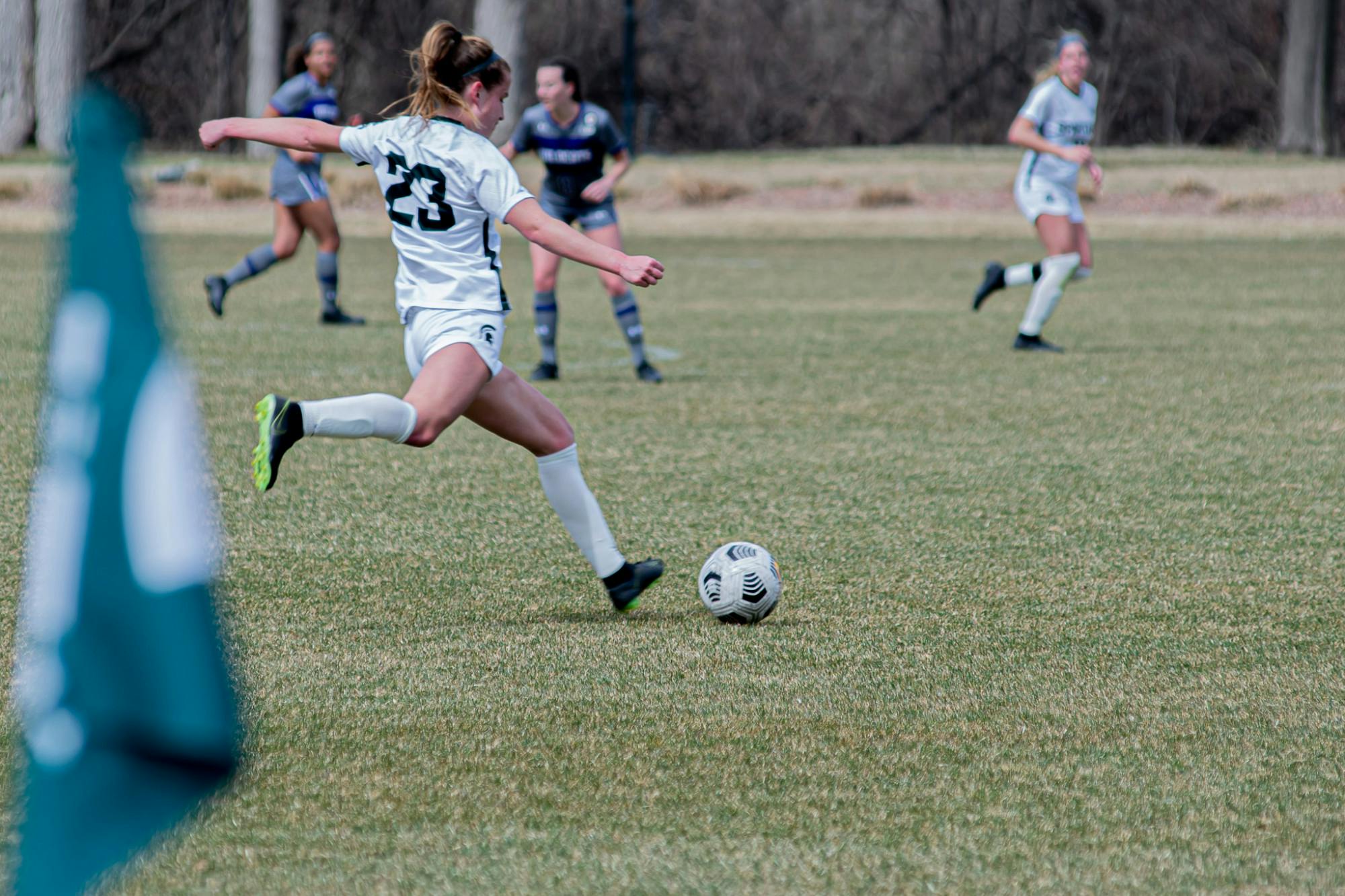 Junior midfielder Sam Sklarski passes the ball down field, during the Spartans' 1-0 overtime loss to the Wildcats on Mar. 25, 2021. The loss was the Spartans' sixth in a row.