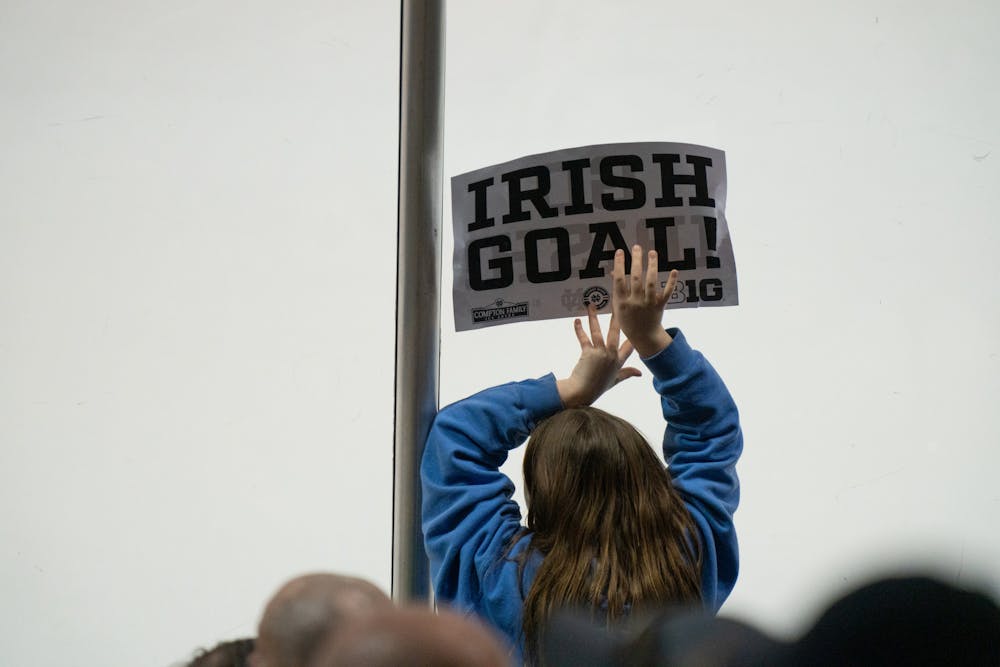 <p>A young fan holds an “Irish Goal” sign against the glass at Compton Family Ice Arena in Notre Dame, IN on Friday, March 4, 2023. Over 5,000 fans attended the Saturday evening matchup.</p>