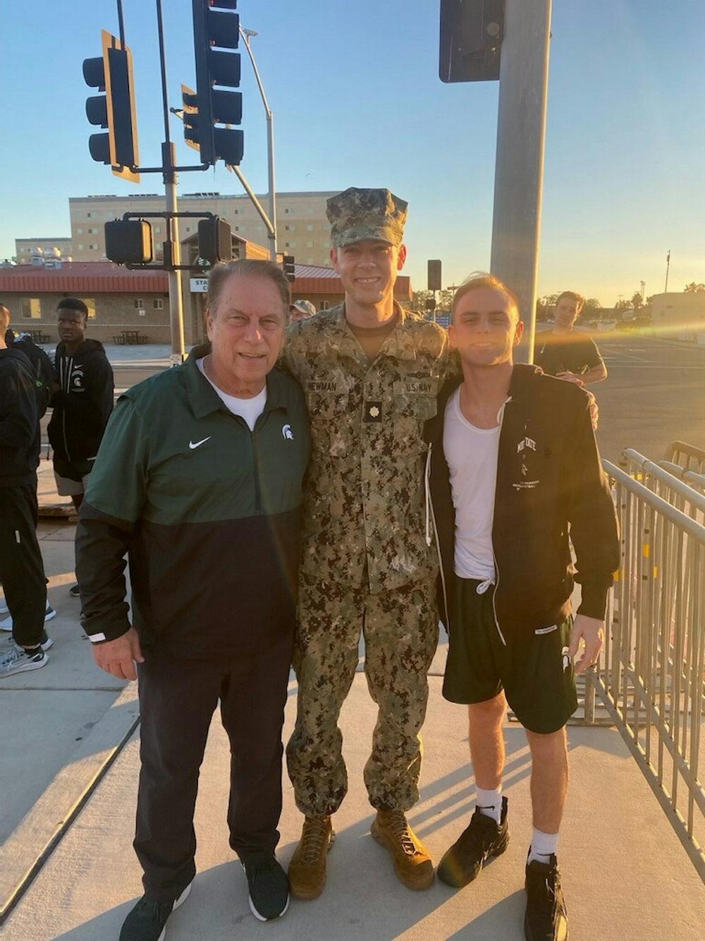 Lieutenant Commander Sean Newman meets up with Tom and Steven Izzo one day before the Armed Forces Classic on the USS Abraham Lincoln. Photo courtesy of MSU Athletics. 
