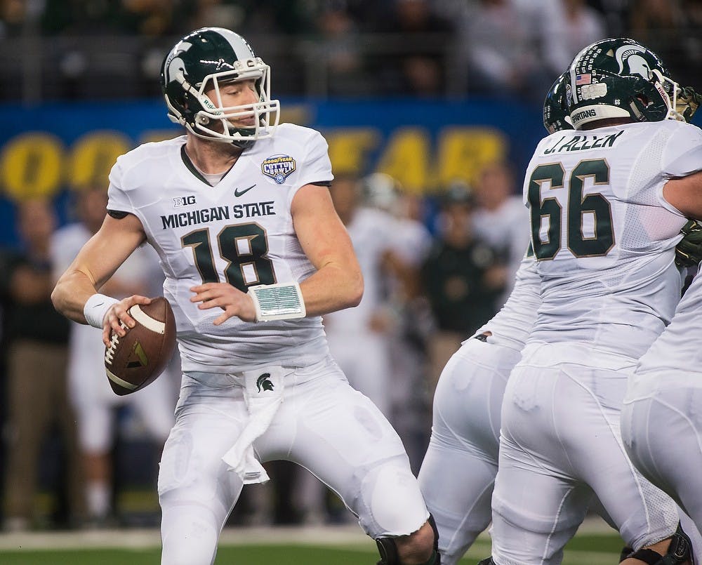 <p>Junior quarterback Connor Cook looks to pass the ball Jan. 1, 2015, during The Cotton Bowl Classic football game against Baylor at AT&amp;T Stadium in Arlington, Texas. The Spartans defeated the Bears and claimed the Cotton Bowl Victory, 42-41. Erin Hampton/The State News</p>
