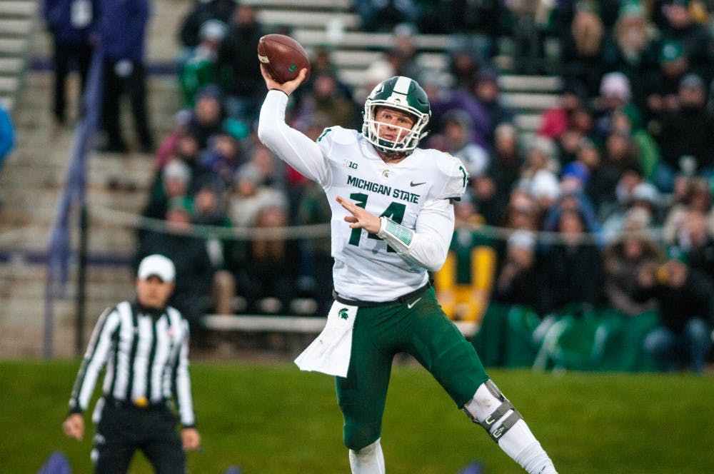 Sophomore quarterback Brian Lewerke (14) throws the football during the game against Northwestern on Oct. 28, 2017, at Ryan Field. The Spartans fell to the Wildcats, 39-31, in 3OT.