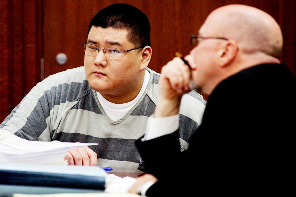Alleged murderer Benjamin French looks to his defense attorney Tony Spagnuolo as prosecutor Bill Crino address the motions proposed by the defense team Thursday afternoon at the 30th District Court in Lansing. French is being charged with the murder of Lansing Catholic Central classmates Owen Goodenow and Darren Brown after a robbery plan left the two dead. Matt Hallowell/The State News