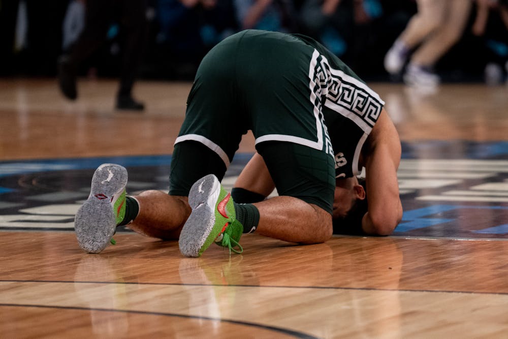 Senior forward Malik Hall stays on the ground after a close game in the Sweet Sixteen matchup against Kentucky State University at Madison Square Garden on March 23, 2023. The Spartans fell to the Wildcats with a score of 98-93. 