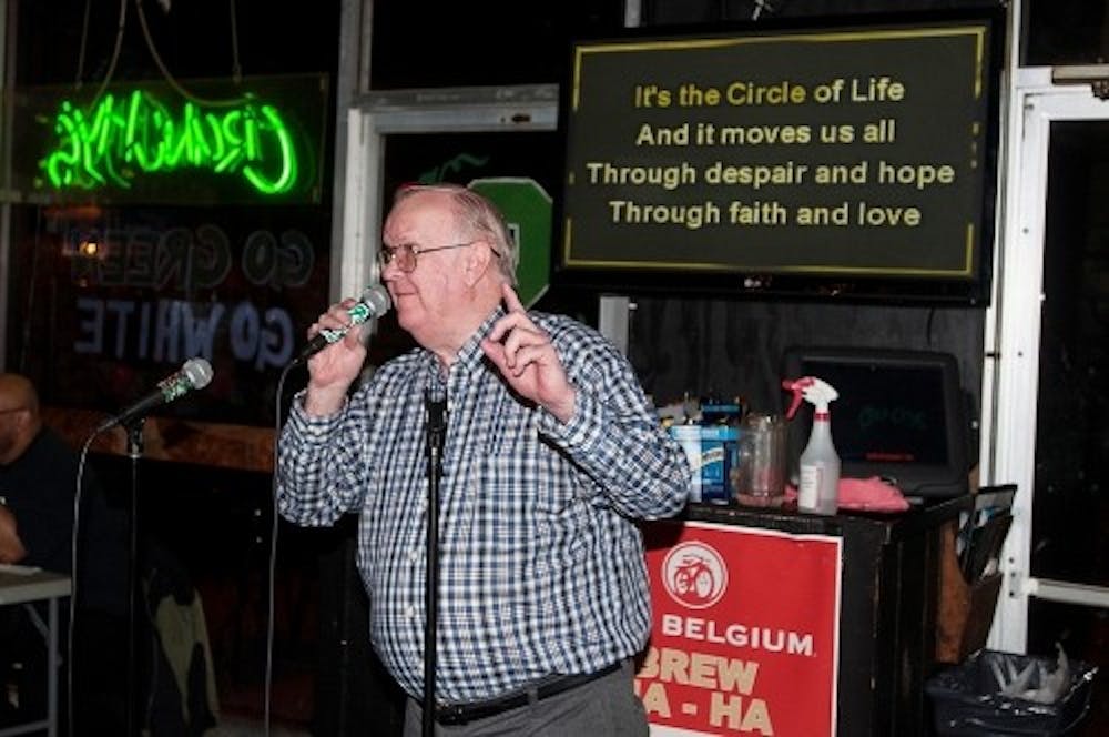 <p>Lansing resident Dennis Foreback, sings the "The Circle of Life" at Crunchy's on April 10, 2014. Foreback has performed regularly at Crunchy's for the past two years. Allison Brooks/ The State News</p>