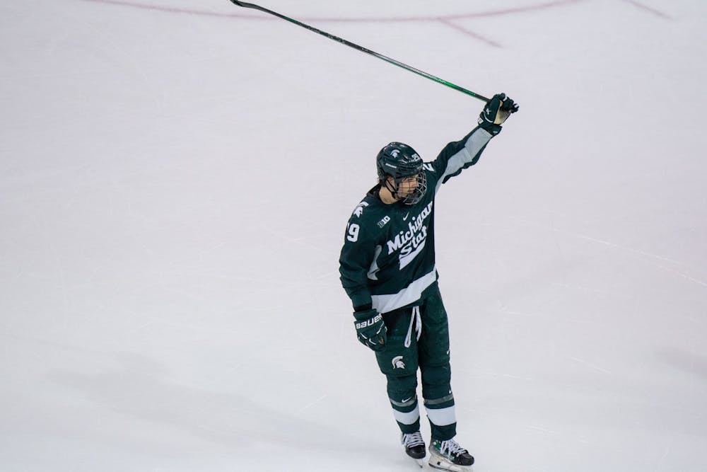 Freshman forward Gavin O'Connell (29) celebrates a scored goal during a game against University of Michigan at Yost Ice Arena on Feb. 9, 2024. O'Connell scored 1 of the 5 Spartan goals as they took down the Wolverines.