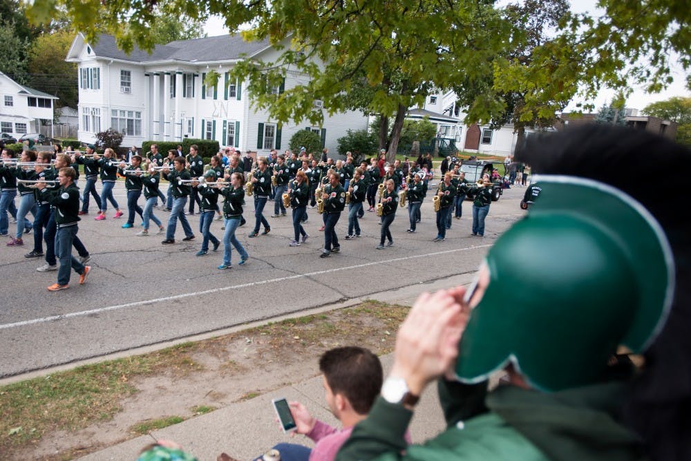 <p>The Spartan Marching Band performs the Fight Song during the Homecoming Parade on Oct. 2, 2015, on Abbott Road in East Lansing. </p>