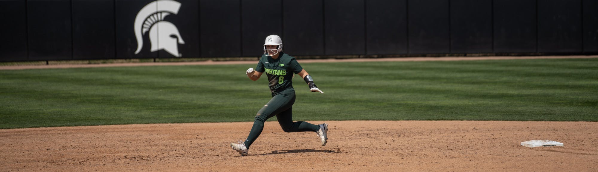 <p>Spartan Brooke Snyder rounds second and heads for third base during her game against the Minnesota Golden Gophers on April 15, 2023.</p>