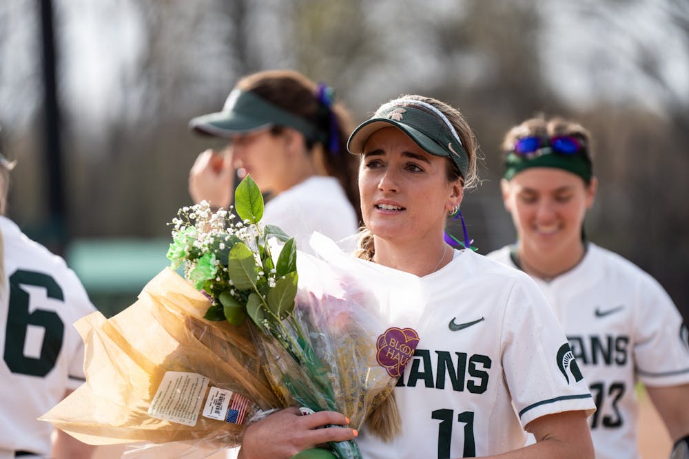 <p>Senior Caitie Ladd, in lieu of her senior night, holds flowers she was given before the match on April 29th, 2022. </p>