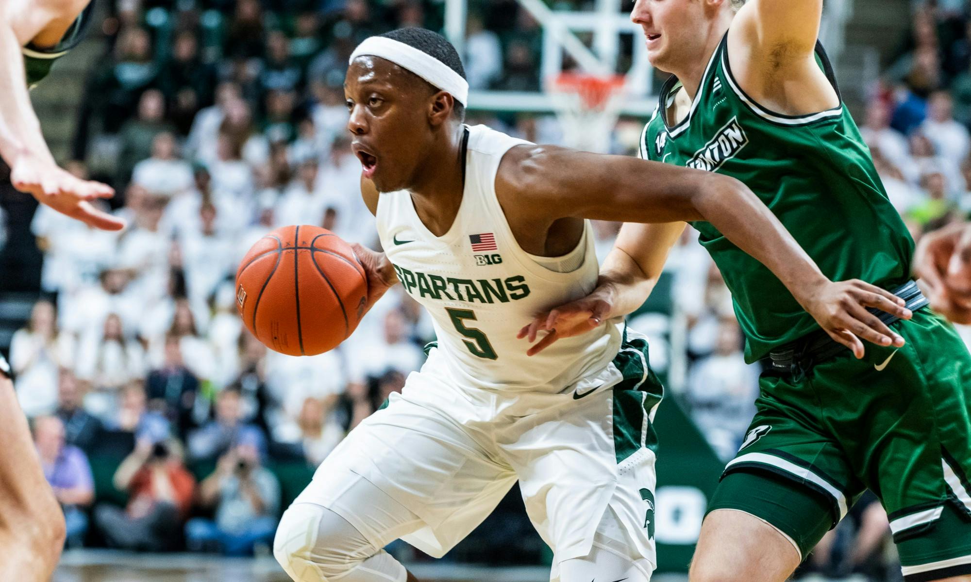 <p>Senior guard Cassius Winston (5) drives to the lane against Binghamton. The Spartans lead the Bearcats 51-23 at halftime at the Breslin Student Events Center on Nov. 10, 2019. </p>