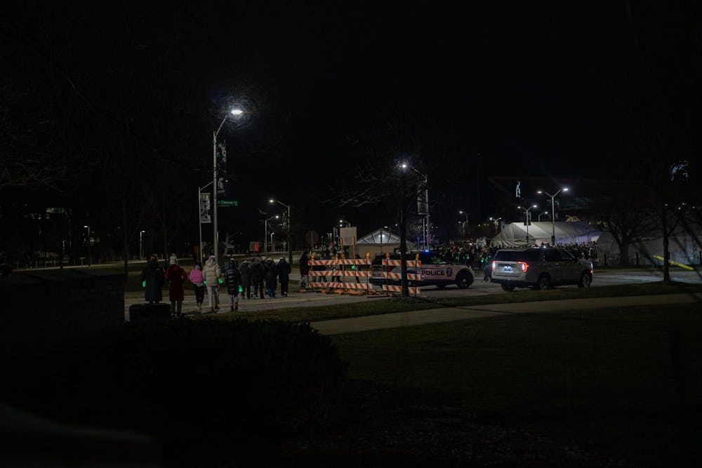 <p>MSU students walk from the Spartan Statue to the tents at the remembrance event on Feb. 13, 2024. One year after the Michigan State University campus shooting, a remembrance ceremony was held to remember and reflect on the tragedy.</p>