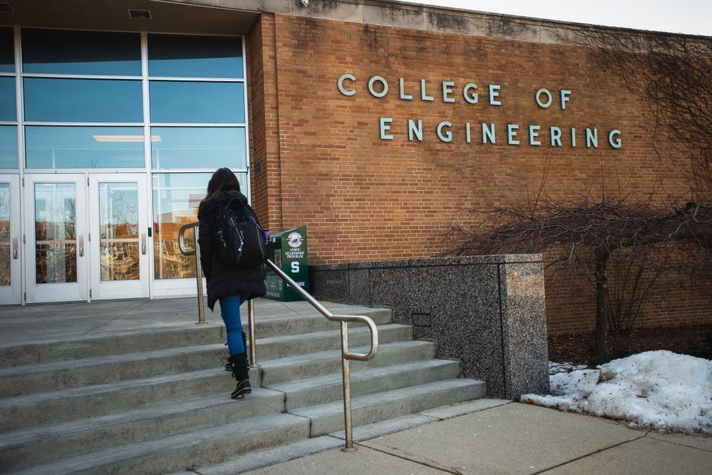 <p>A mechanical engineering student walks into the Engineering Building on March 11, 2019.</p>