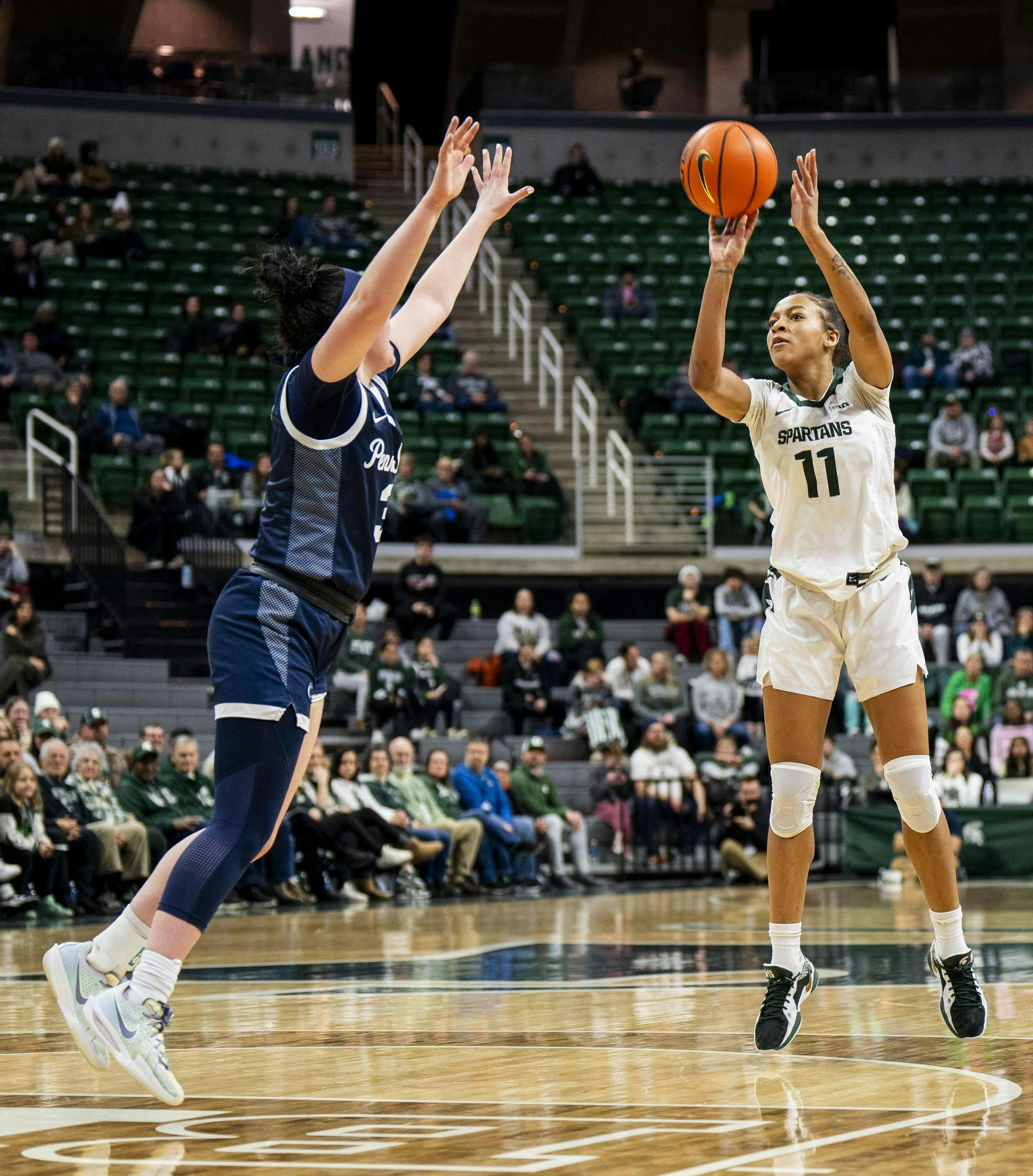 <p>Michigan State senior guard/forward Jocelyn Tate (11) shoots the ball while Penn State redshirt sophomore guard Moriah Murray (3) guards her at the Breslin Center on Jan. 22, 2025. The Spartans defeated the Nittany Lions 82-61.</p>
