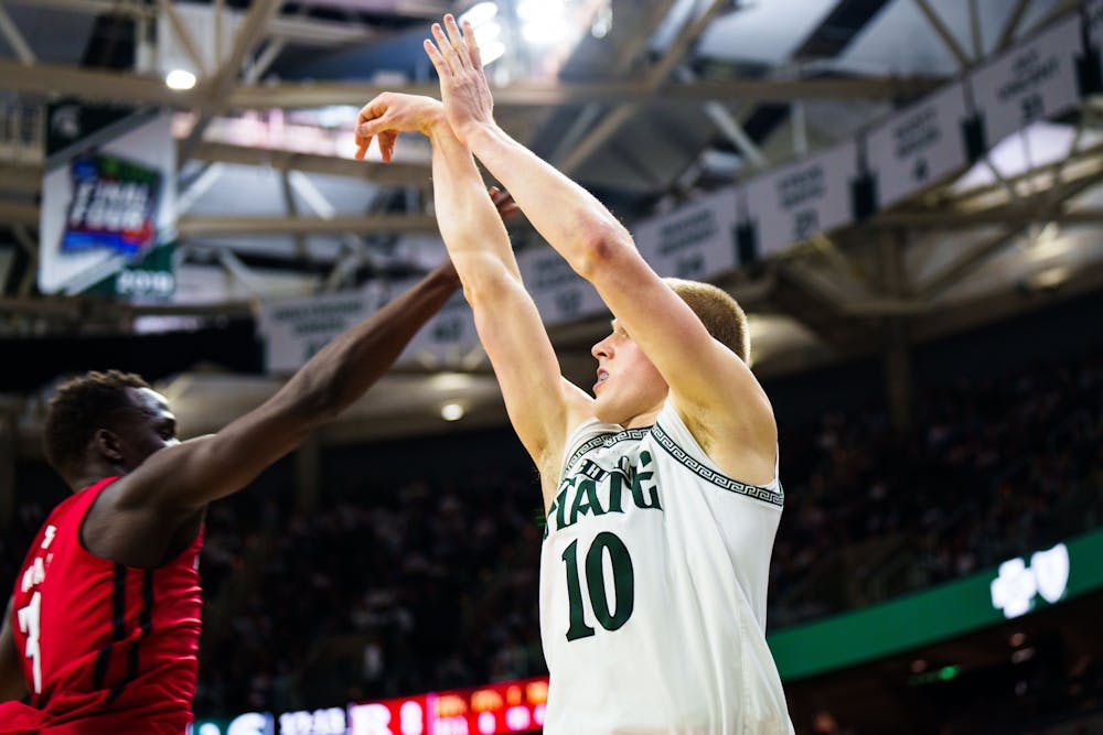 <p>Graduate Student forward Joey Hauser (10) attempts a three point shot during a matchup against Rutgers, held at the Breslin Center on Jan. 19, 2023. The Spartans defeated the Scarlet Knights 70-57.</p>