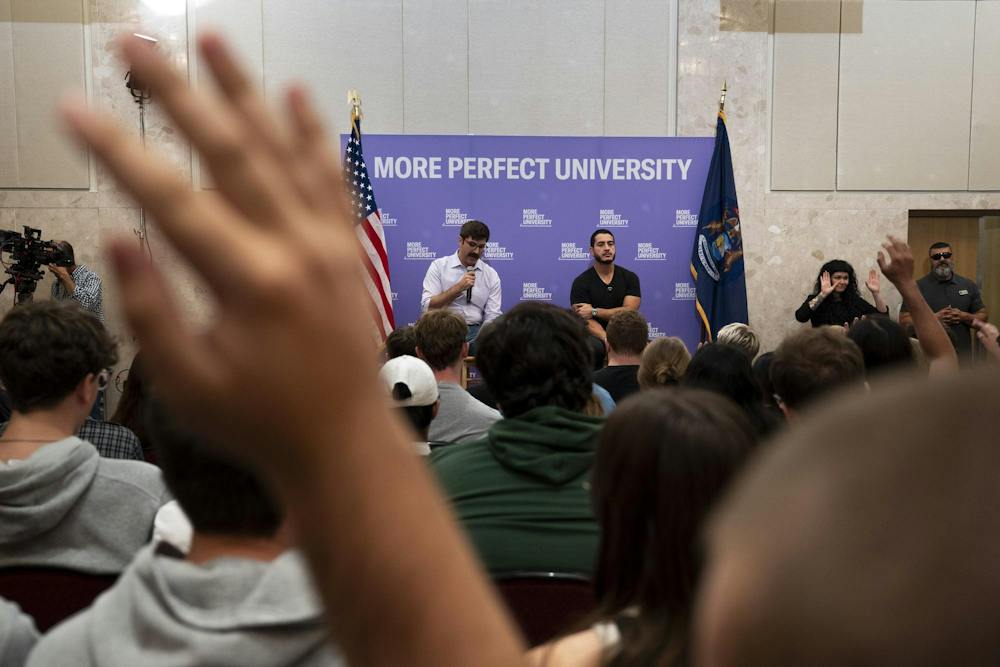 <p>A Michigan State University student raises their hand to ask a question during an Abdul El-Sayed rally at the Student Union in East Lansing, Mich., on Sept. 11, 2026.</p>