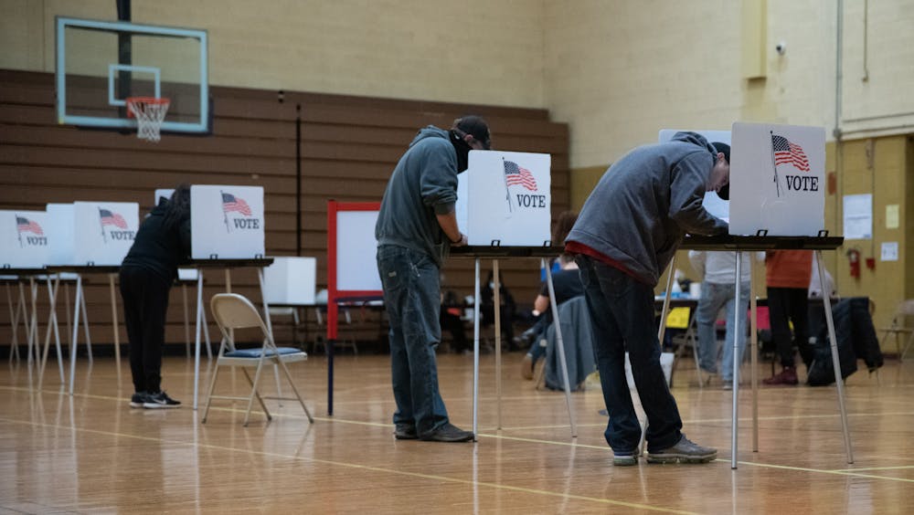 Lansing residents filling out ballots at the Southside Community Center polling location on Tuesday, November 3, 2020