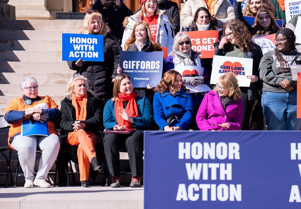 Gov. Gretchen Whitmer shares a laugh with former Arizona U.S. representative Gabby Giffords at the gun rally at the Michigan State Capitol on March 15, 2023. 