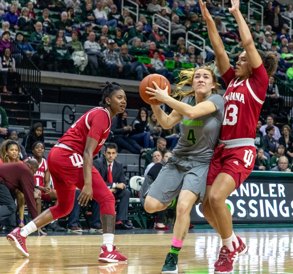 Junior guard Taryn McCutcheon (4) draws contact during the game against Indiana on Feb.11, 2019. The Spartans lead the Hoosiers 33-30 at halftime.