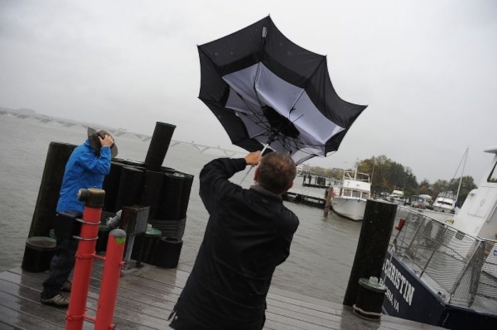 <p>Pedestrians fight the high winds and rain from Hurricane Sandy in Alexandria, Virginia, on Monday, October 29, 2012. (Olivier Douliery/Abaca Press/MCT)<br>
</p>