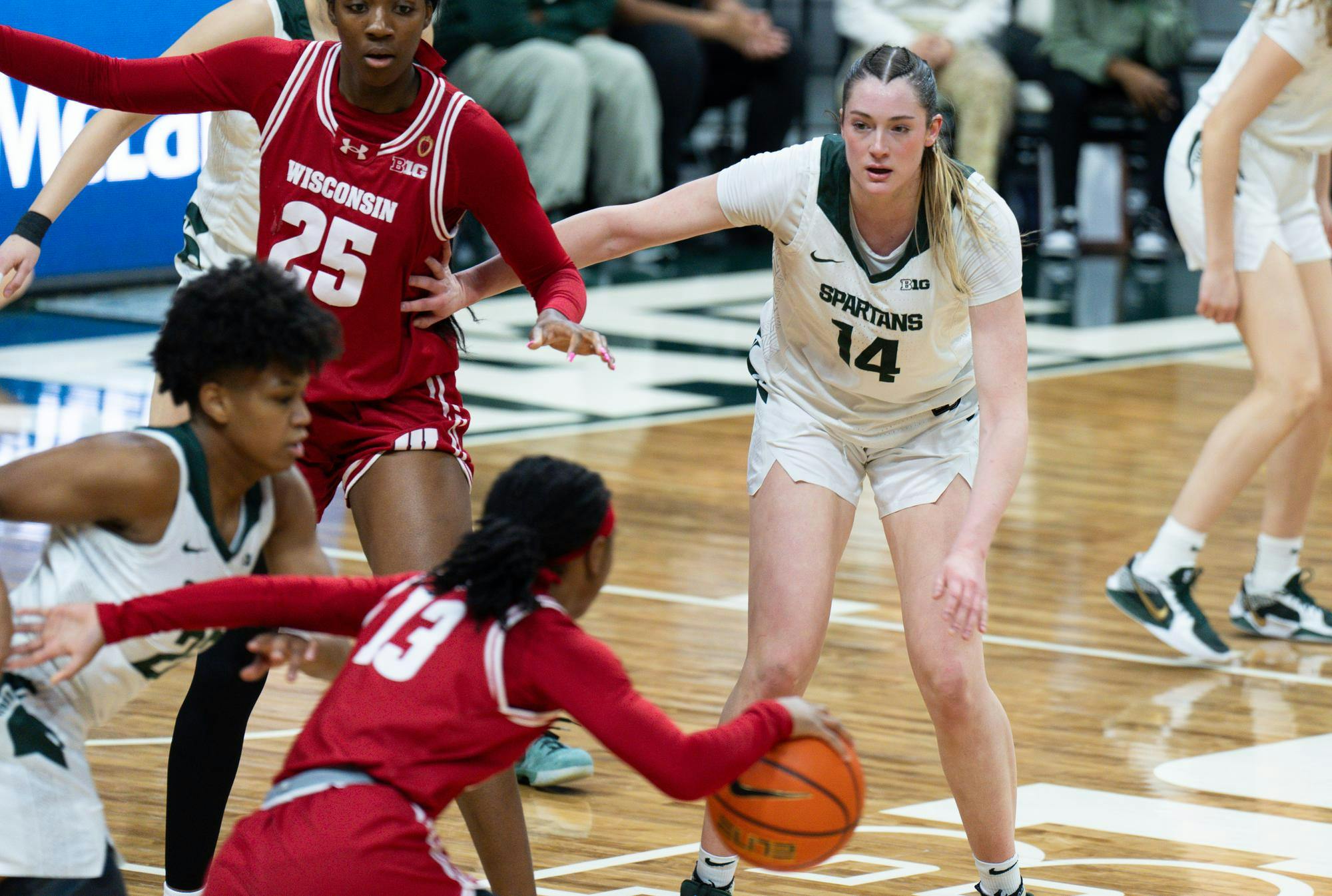 <p>Grace Vanslooten, 14, blocks Serah Williams, 25, on Feb. 12, 2025. The Spartans advanced throughout the game and won 91-71.</p>