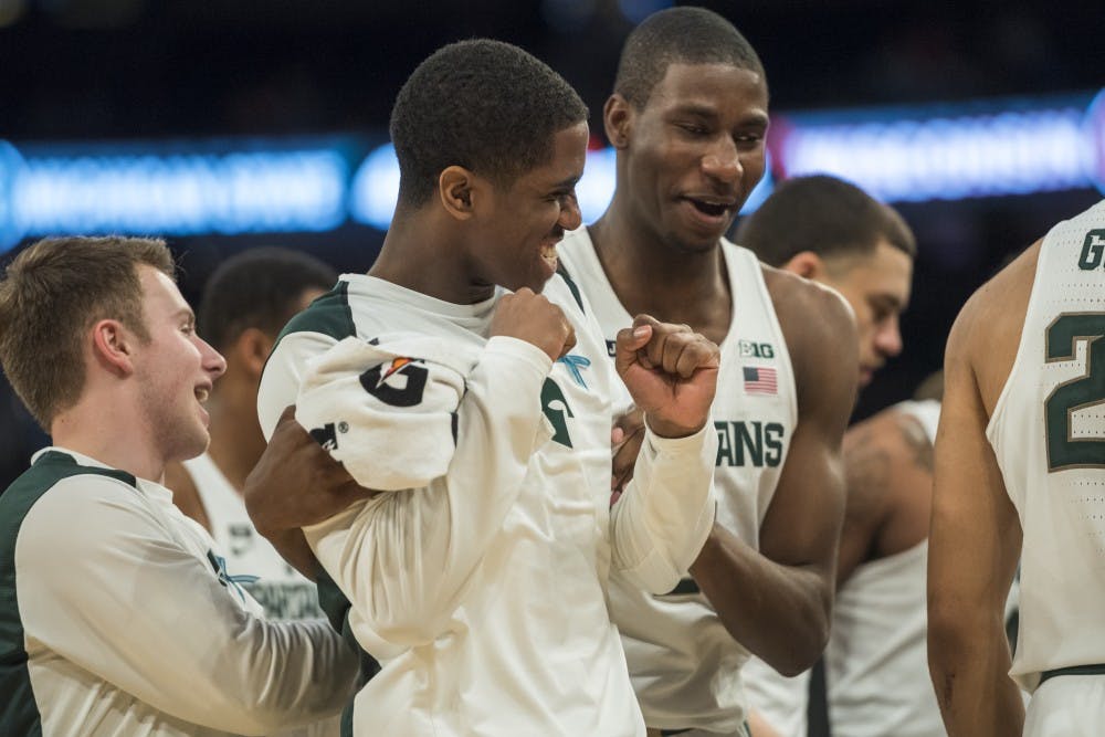 Freshman guard Brock Washington (14), left, and freshman forward Jaren Jackson Jr. (2) share a moment during the second half of the 2018 Big Ten Men's Basketball quarterfinal game against Wisconsin on March 2, 2018 at Madison Square Garden in New York. (Nic Antaya | The State News)