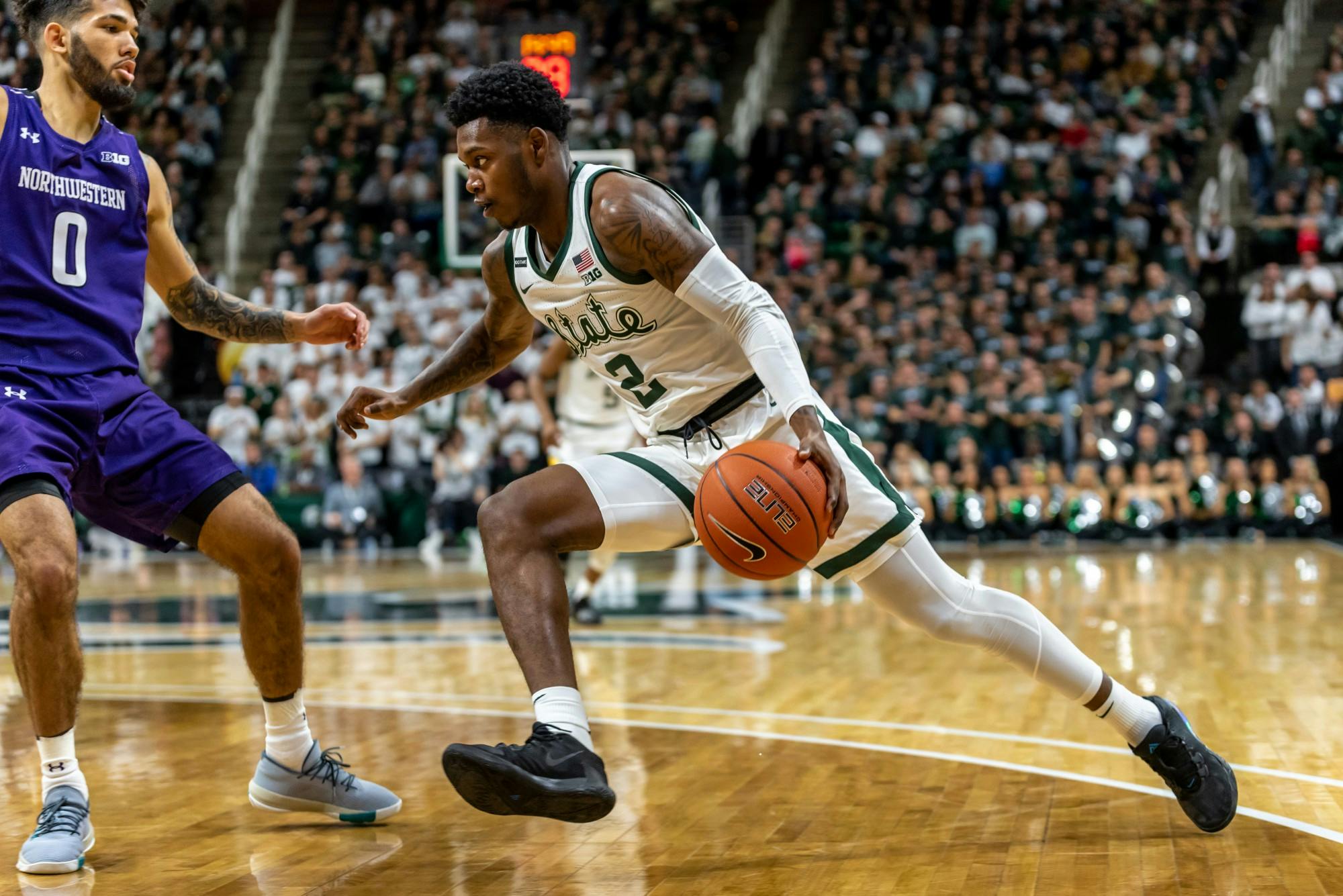 Freshman guard Rocket Watts (2) drives on Northwestern’s Boo Buie (0).The Spartans defeated the Wildcats, 79-50, at the Breslin Student Events Center on January 29, 2020. 