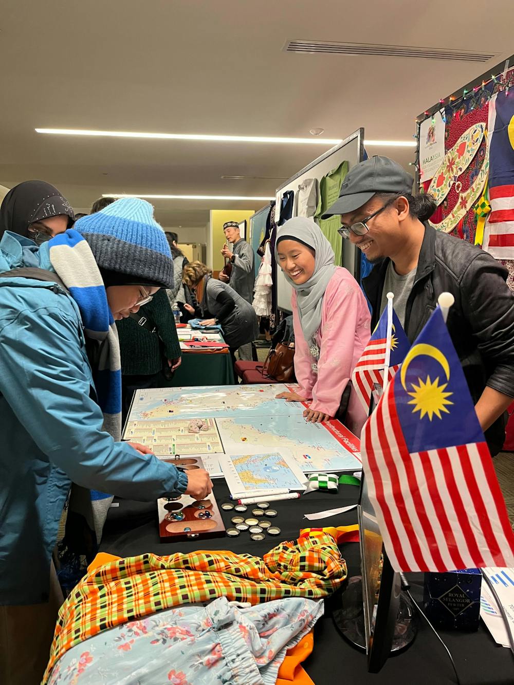 Students play a game at the Malaysian Student Organization booth at the Global Festival on Nov. 13, 2022.