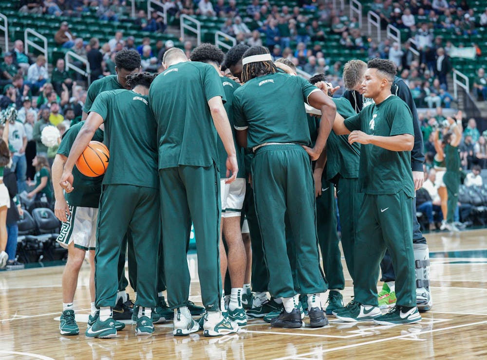 The MSU men’s basketball team huddle up before the start of the game against Hillsdale at the Breslin Center on Oct. 25, 2023. The Spartans defeated the Chargers 85-43. 