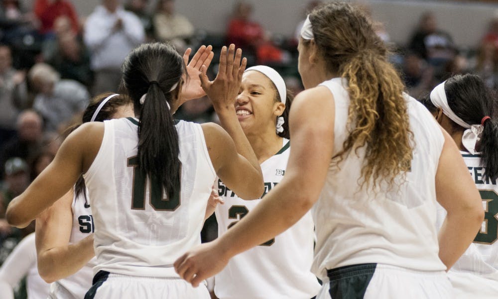 Junior forward Aerial Powers and sophomore guard Branndais Agee high five during the women's basketball Big Ten championship game against Purdue on March 4, 2016 at Bankers Life Fieldhouse in Indianapolis. The Spartans defeated the Boilermakers, 65-64.