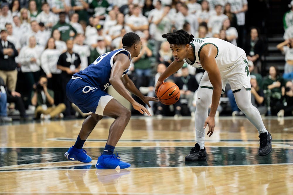 <p>MSU Senior Guard A.J. Hoggard (11) squares off with Georgia Southern Freshman Guard Eren Banks (13) at mid court of the Jack Breslin Student Events Center on Nov. 28, 2023. Hoggards; Spartans would go on to win 86-55.</p>