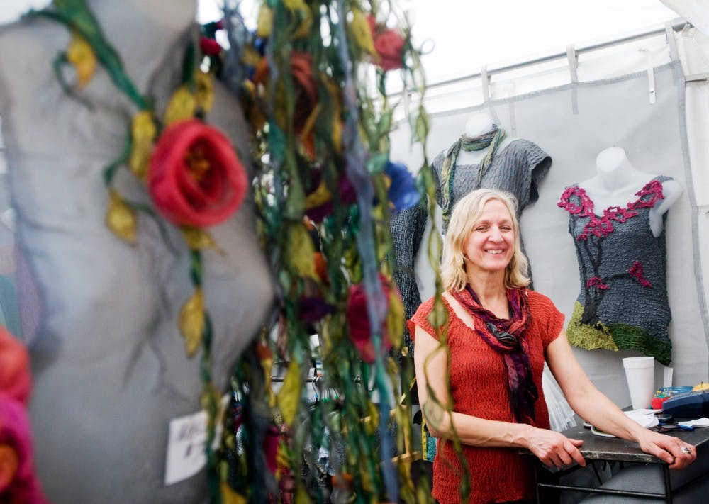 Leah Dziewit showcases her collection of hand-dyed, silk apparel at the East Lansing Art Festival on Saturday May 21. She has been a returning artist to the festival for almost 20 years. State News file photo