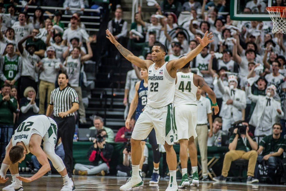 Sophomore guard Miles Bridges (22) holds out his arms during the game against Penn State on Jan. 31, 2018 at Breslin Center. The Spartans trailed the Nittany Lions at 30-24 at halftime. 