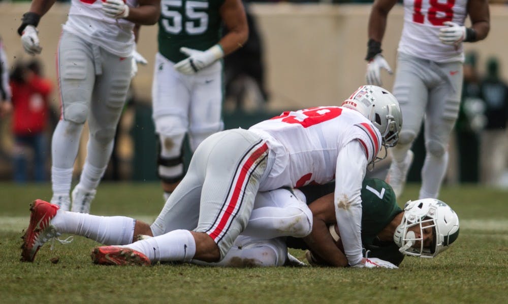 Sophomore wide receiver Cody White (7) is tackled during the game against Ohio State at Spartan Stadium on Nov. 10, 2018. The Spartans fell to the Buckeyes, 26-6.