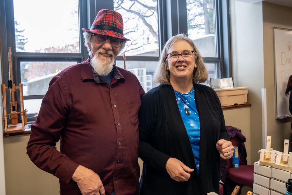 Karl and Mary, also known as “Mr. and Mrs. Catapult Guy,” pose for a photo at their table where they sell marshmallow catapults during Michigan State’s annual winter arts and craft show at the Union on campus in East Lansing, Mich., on Saturday, Dec. 6, 2025. “I started this with my Cub Scout,” Karl said. “So it’s been fun, I’ve been doing this since the ’90s, so a long time.”